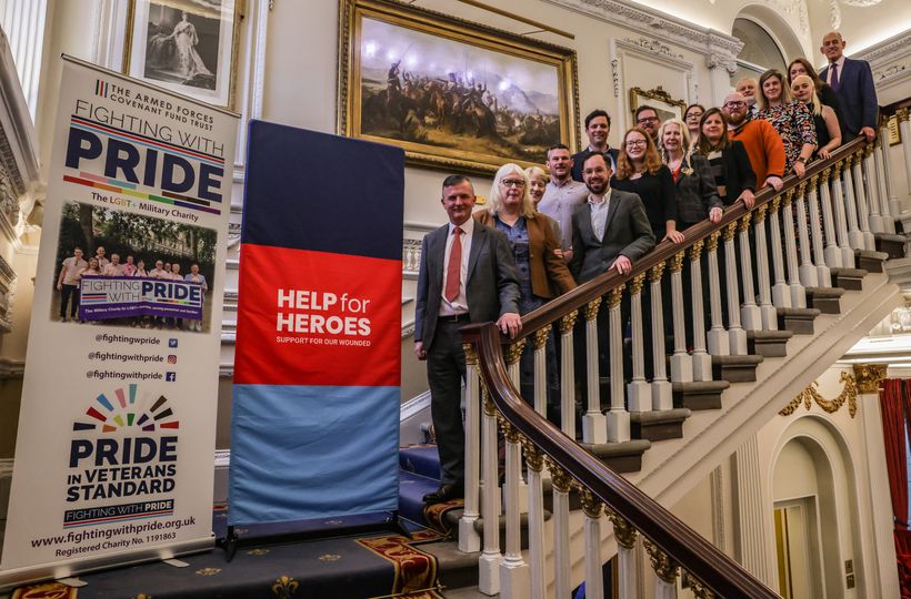 Participants at LGBT+ veteran roundtable standing on stairway